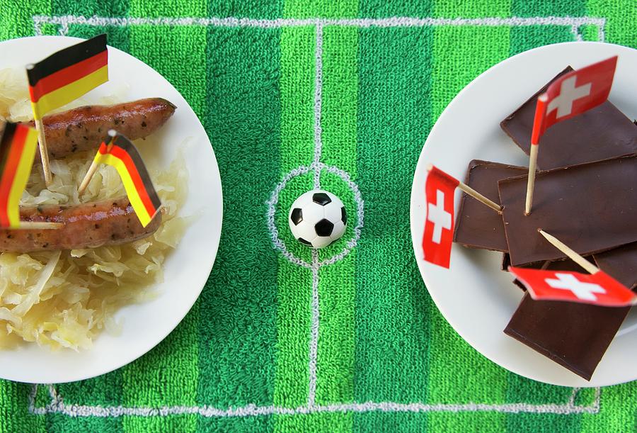 Sausages With Cabbage germany And Chocolate switzerland With Football-themed Decoration Photograph by Schindler, Martina