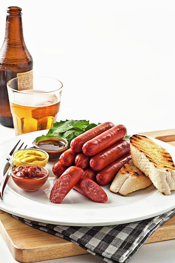 Sausages With Grilled Bread, Sauces And Beer Photograph by The Food Union