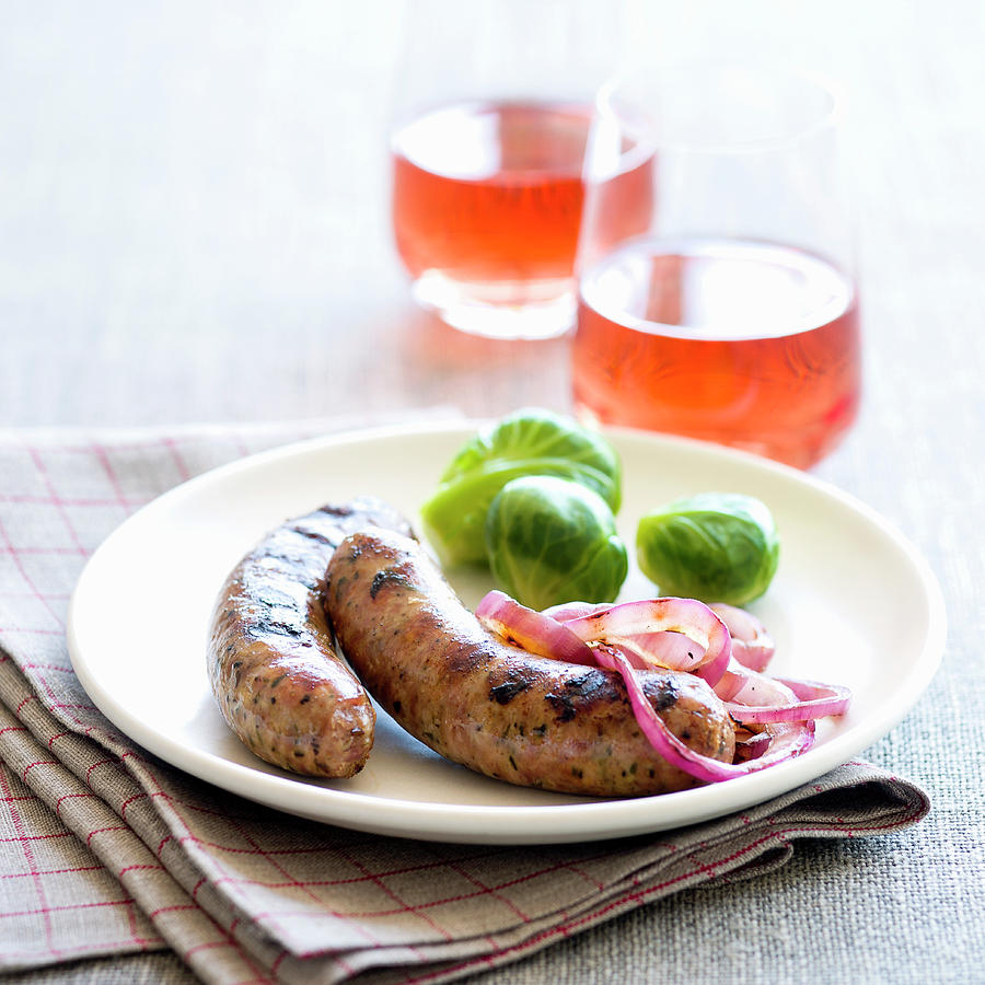 Sausages With Red Onions And Brussels Sprouts Photograph by Leo Gong