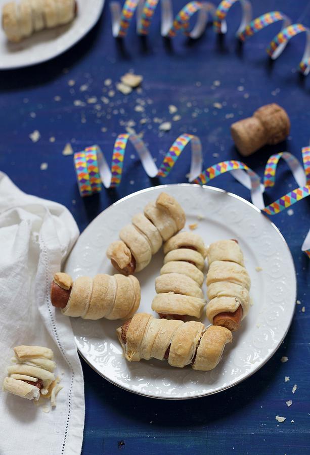 Sausages Wrapped In Puff Pastry For New Years Eve Photograph by Adel Bekefi