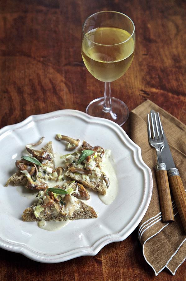 Sauted Wild Mushrooms On Bread With White Wine Photograph by Andre Baranowski