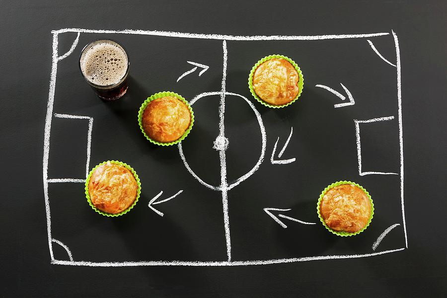 Savoury Muffins And Cola For A Football-themed Party Photograph by Birgit Twellmann