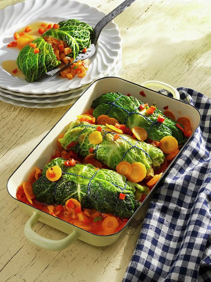 Savoy Cabbage Roulade Filled With Hokkaido Pumpkin And Sweet Potatoes Photograph by Karl Newedel