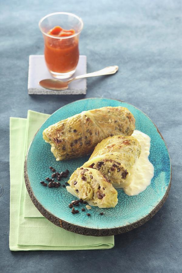 Savoy Cabbage Roulades With Carrot Sauce Photograph by Uwe Bender