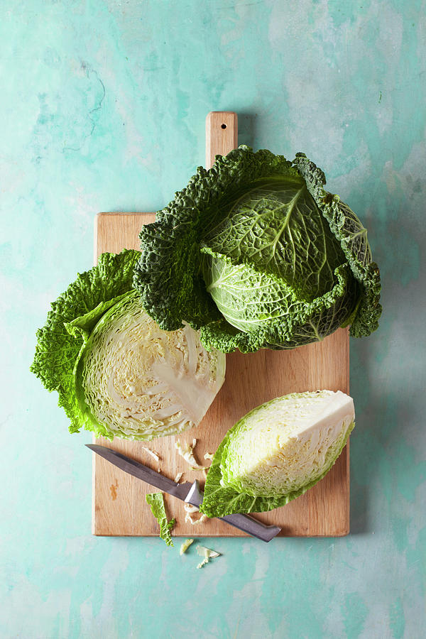 Savoy Cabbage, Whole And Sliced Photograph by Anke Politt / Stockfood Studios