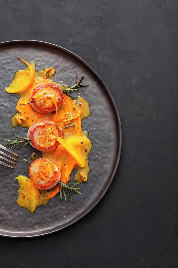 Scallops On Pumpkin Cream With Orange And Cardamom Butter Photograph by Jalag / Mathias Neubauer