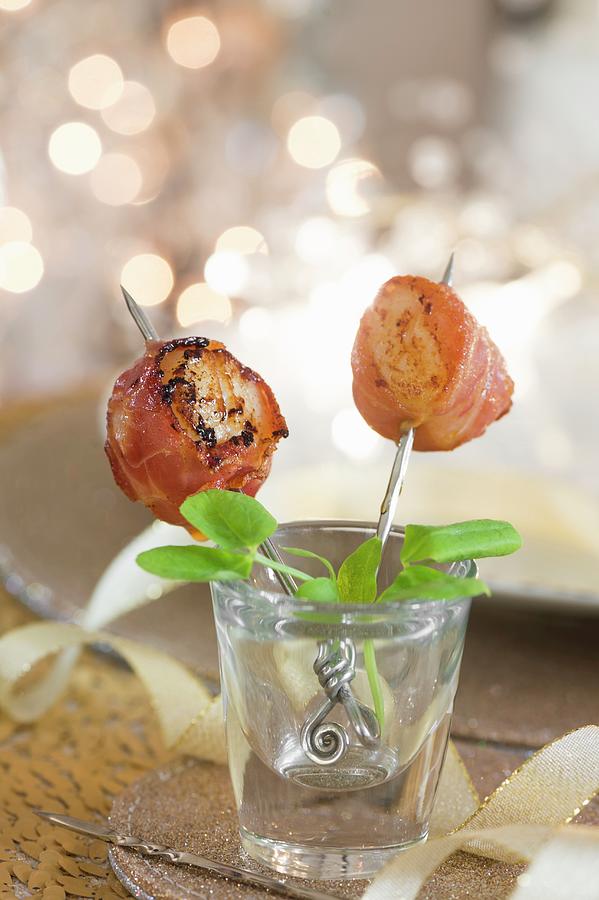 Scallops Wrapped In Serrano Ham On Sticks For Christmas Photograph by Winfried Heinze