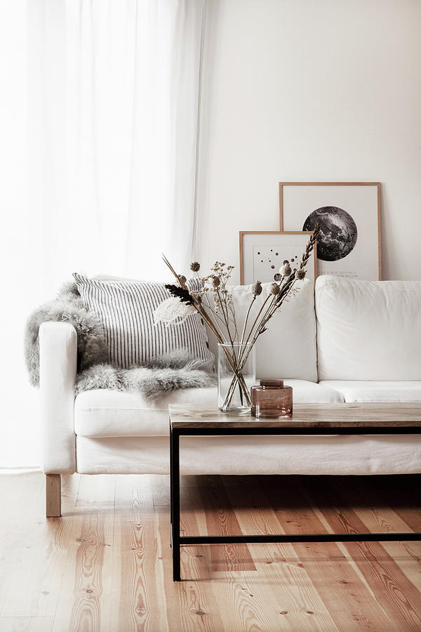 Scatter Cushion And Fur Rug On White Couch Behind Coffee Table Photograph by Hej.hem Interior