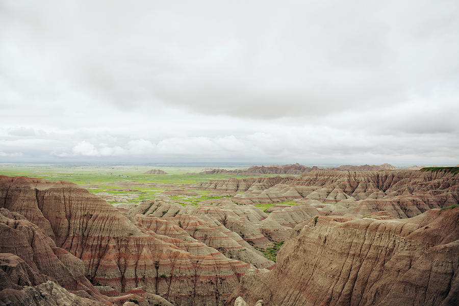 Badlands National Park Photograph - Scenic View Of Rock Formations At Badlands National Park Against Cloudy Sky by Cavan Images