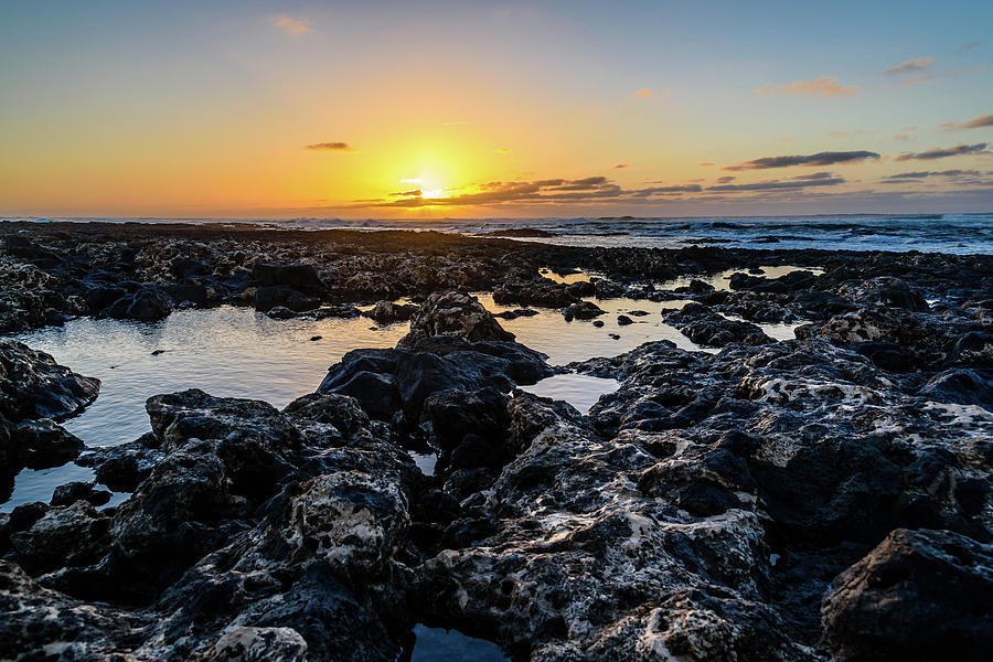 Scenic View Of Rocky Beach  At Sunset Photograph