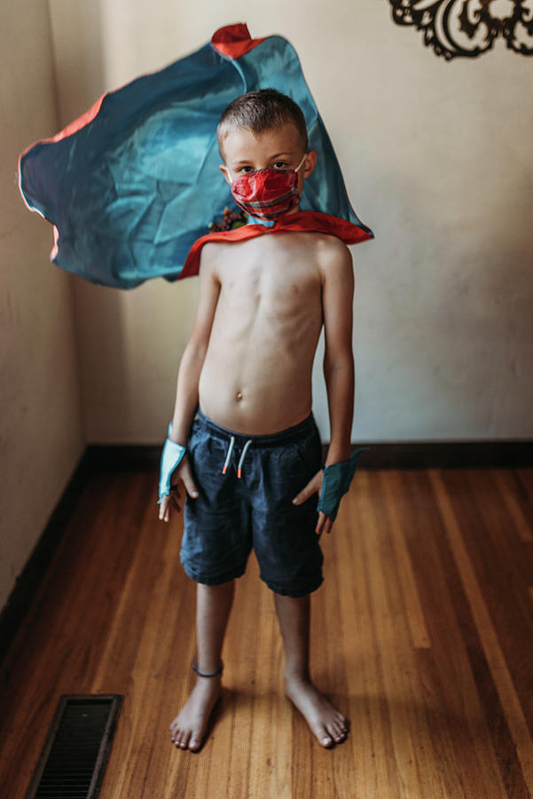 Halloween Photograph - School Age Young Boy Dressed As Super Hero With Mask On by Cavan Images
