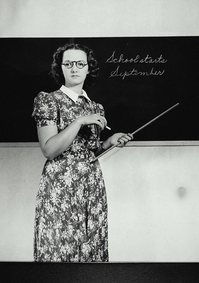School Teacher Standing In Front Of Photograph by Archive Holdings Inc. School Teacher Standing In Front Of Photograph by Archive Holdings Inc.