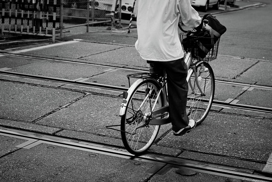 Schoolboy Bicycling Across Railroad Photograph by Hedgy Nathan Wright