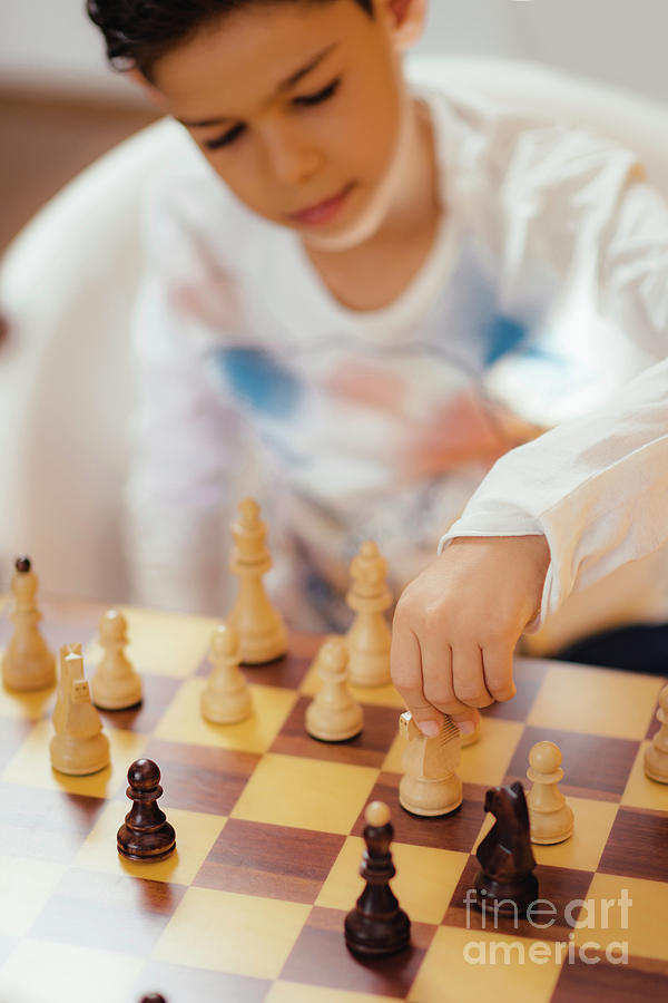 Schoolboy Playing Chess Photograph by Microgen Images/science Photo Library
