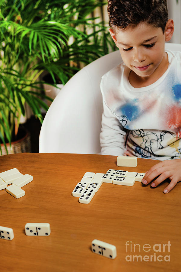 Toy Photograph - Schoolboy Playing Dominoes by Microgen Images/science Photo Library
