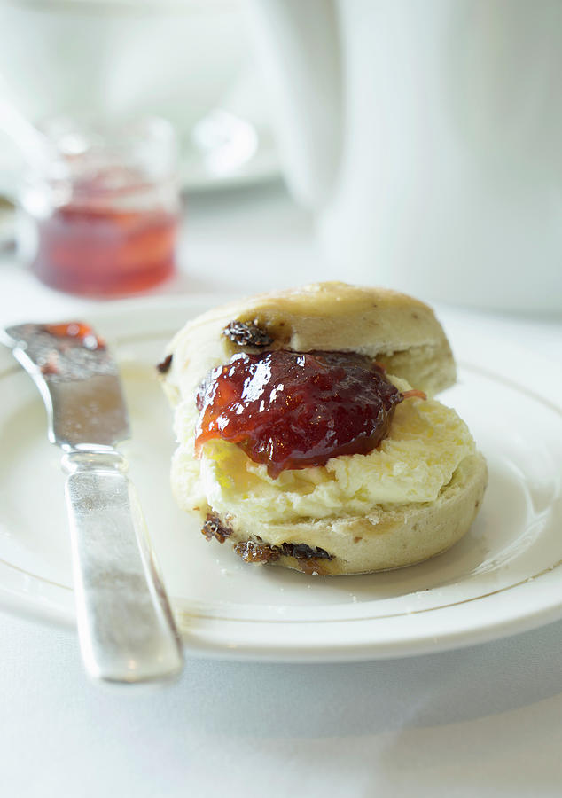 Scone With Clotted Cream And Strawberry Jam Photograph by Martina Schindler