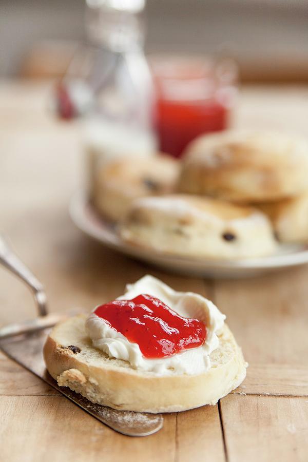 Scones With Clotted Cream And Strawberry Jam england Photograph by Claudia Timmann