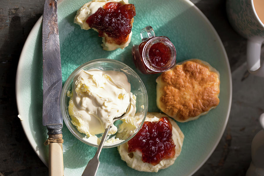 Scones With Jam And Clotted Cream For Afternoon Tea Photograph by Lara Jane Thorpe