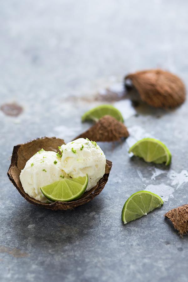 Scoops Of Coconut And Lime Ice Cream In A Coconut Shell Photograph by Malgorzata Laniak