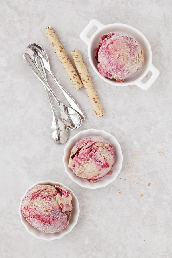 Scoops Of Nutella, Chocolate And Blackberry Ripple Ice Cream With Wafer Rolls Photograph by Jane Saunders