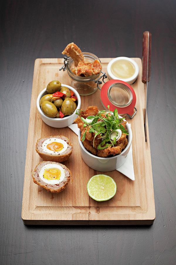Scotch Eggs, Pork Crackling And Olives Photograph by Steven Joyce