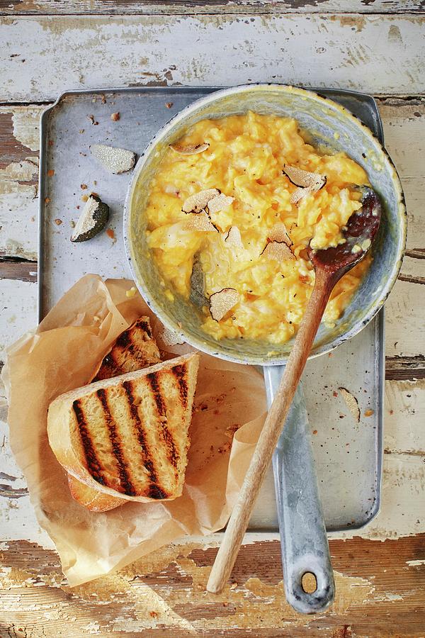 Scrambled Egg With Truffles In A Pan With Toast Photograph by Stuart Ovenden