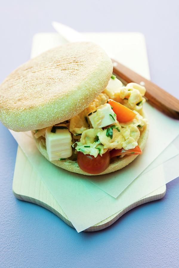 Scrambled Eggs, Feta And Tomatoes In An English Muffin Photograph by Michael Wissing