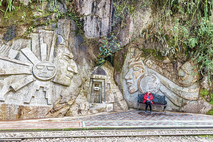 Sculptured art on the rock in Aguas Caliente, Peru. Photograph by Marek ...