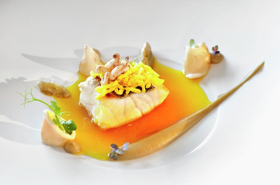 Sea Bass With Puffed Saffron Rice, Aubergines And Calamaretti Photograph by Foto4food