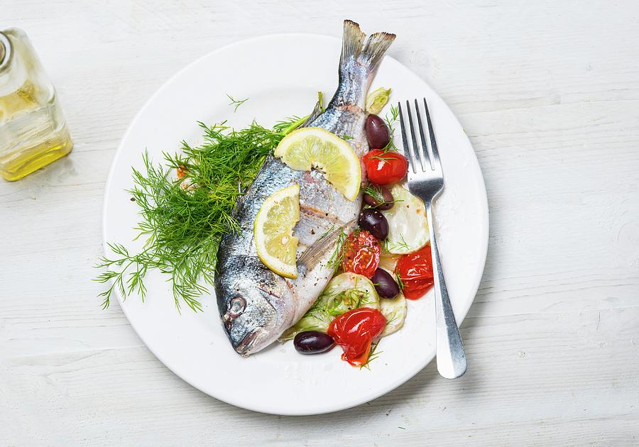 Sea Bream With Tomatoes And Olives Photograph by Mark Zawila