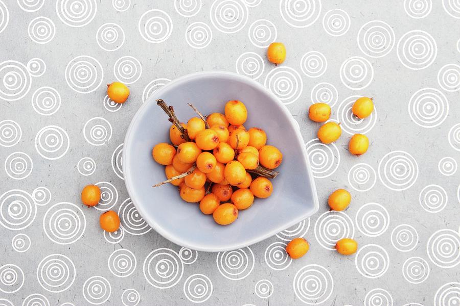 Sea Buckthorn Berries In A Small Bowl And On A Tablecloth view From Above Photograph by Petr Gross