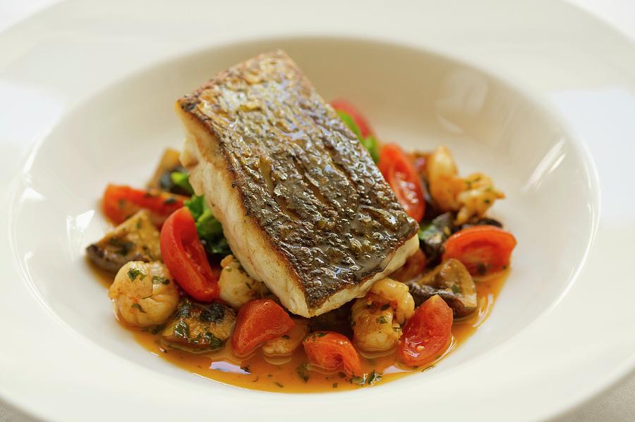Seabass Fillet With Tomatoes, Mushrooms And Lychees Photograph by Tim Winter