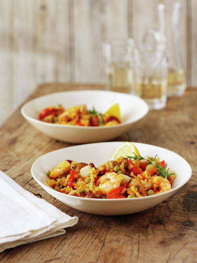 Seafood Paella With Lemon And Rosemary Photograph by Frank Adam