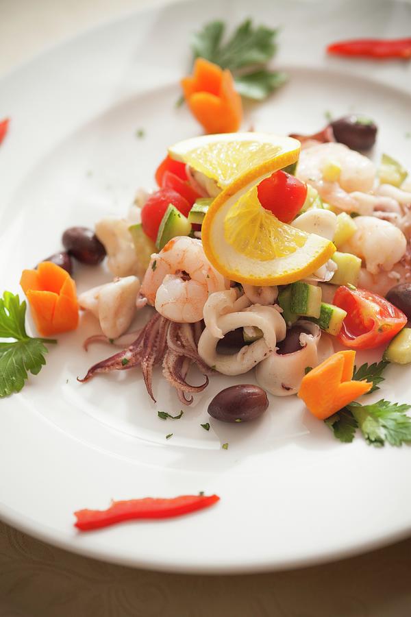 Seafood Salad With Squid, Prawns, Courgettes, Olives And Cherry Tomatoes Photograph by Imagerie