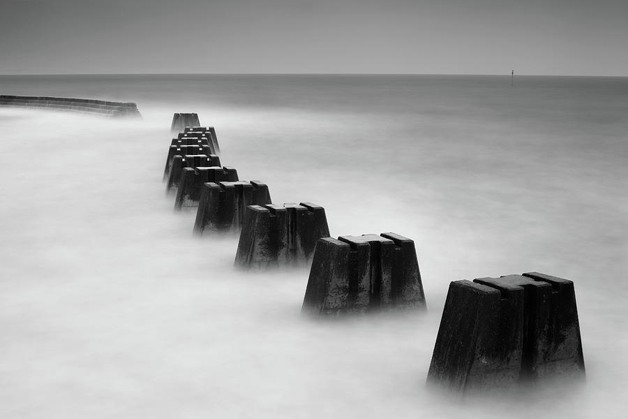 Seascape With Breakwater Jetty Photograph by Angus Clyne