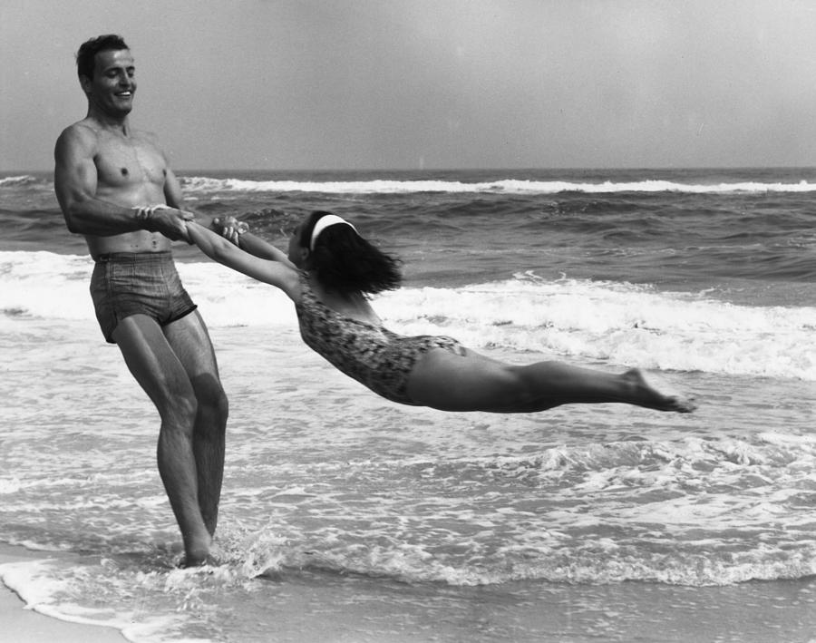 Black And White Photograph - Seaside Games by Camerique Archive