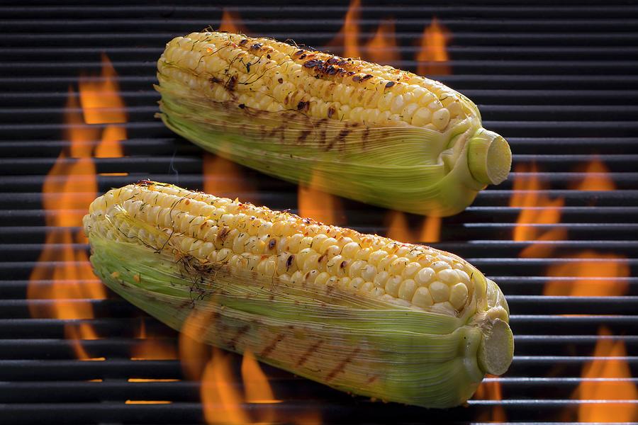 Seasoned Corn-on-the-cob On A Barbecue Photograph by Brian Enright
