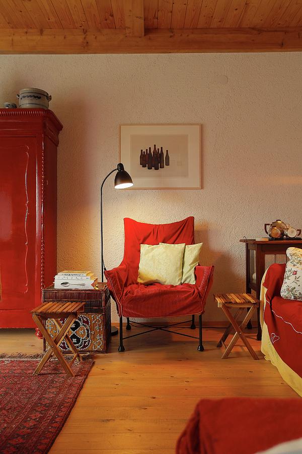Seating Area In Shades Of Red With Chair, Sofa & Cupboard In Village House eggelingen, Ostfriesland, Germany Photograph by Bodo Mertoglu