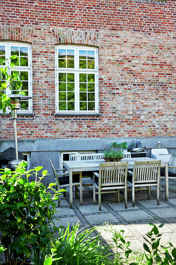 Seating Area On Paved Terrace Adjoining House Photograph by Birgitta Wolfgang Bjornvad