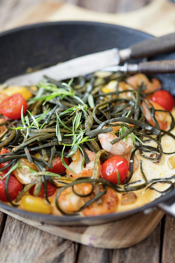Seaweed Pasta With Prawns And Cherry Tomatoes Photograph by Jan Wischnewski