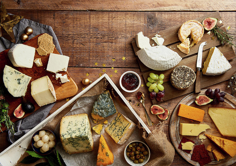 Selection Of Cheeses With Fruit, Crackers, Herbs And Chutney Photograph by Cliqq Photography