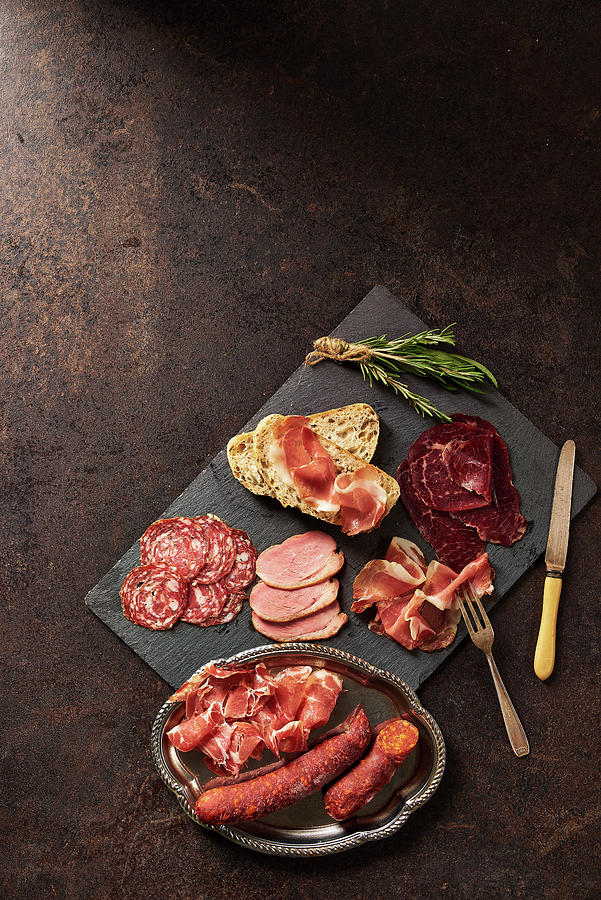 Selection Of Cured Meats With Bread And Rosemary Photograph by Cliqq Photography