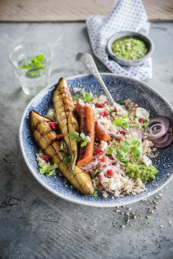 Semolina With Pomegranate Seeds, Pesto, Grilled Aubergine And Merguez Photograph by Thys