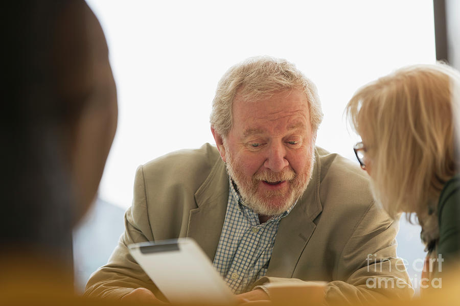 Active Seniors Photograph - Senior Business People Using Digital Tablet In Meeting by Caia Image/science Photo Library Active Seniors Photograph - Senior Business People Using Digital Tablet In Meeting by Caia Image/science Photo Library