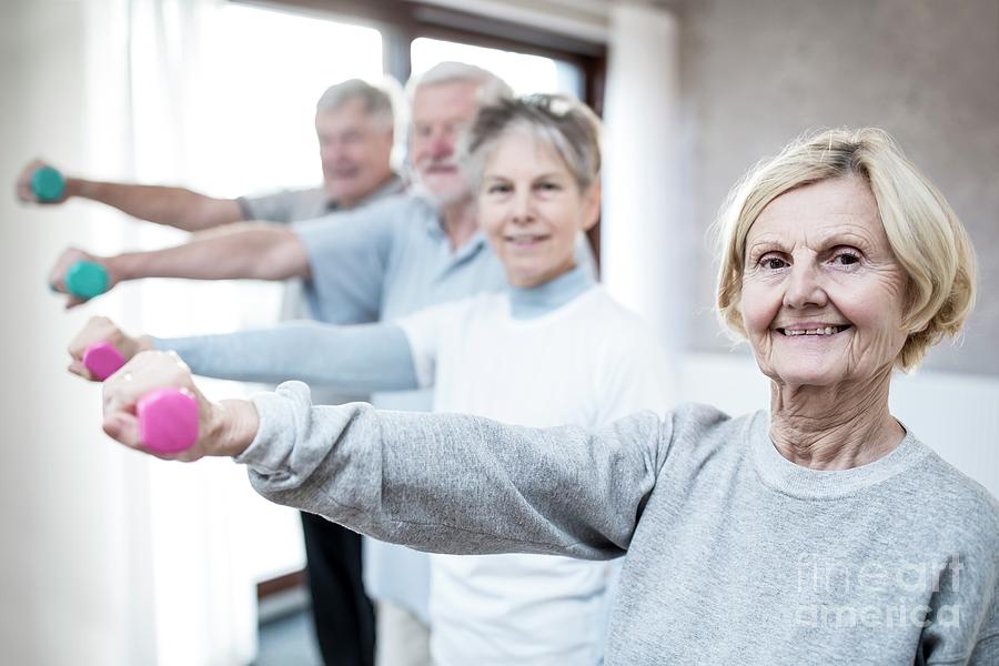 Seniors Holding Hand Weights Photograph by Science Photo Library | Fine ...