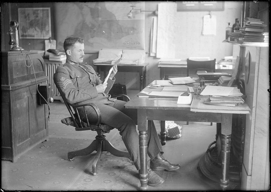 Sergeant at desk reading 1914 Painting by Celestial Images