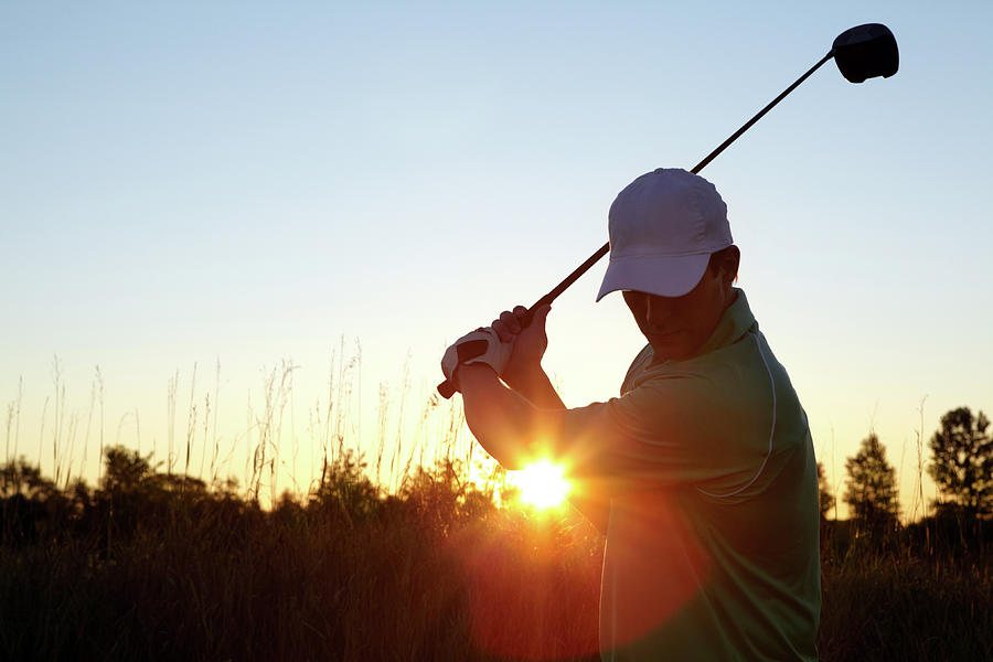 Serious Golfer Photograph by Globalstock