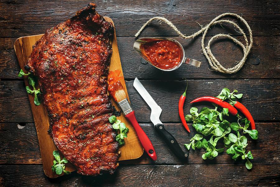 Served Beef Ribs With Bbq Sauce On Wooden Background Photograph by Ltummy