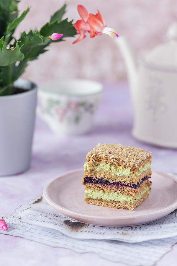 Sesame And Honey Cake With Pistachio Cream And Blackcurrant Jam Photograph by Malgorzata Laniak