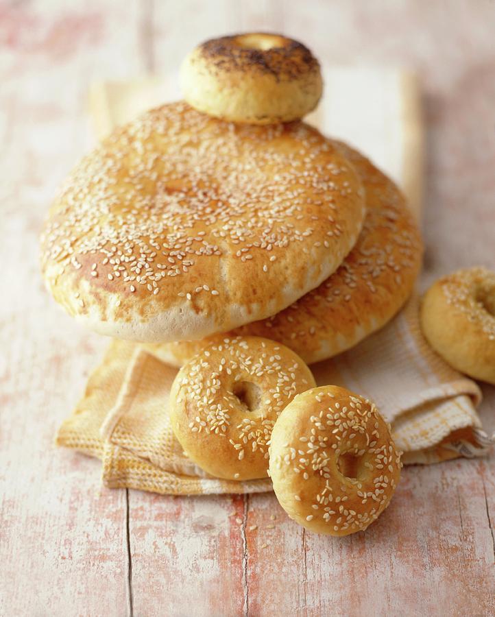 Sesame Flatbreads, Sesame Bagels And A Poppy Seed Bagel Photograph by Michael Wissing